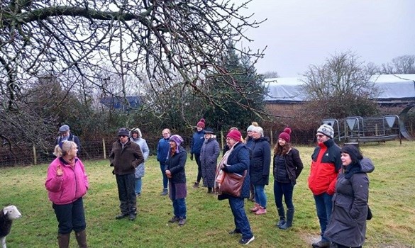 People standing in a field.